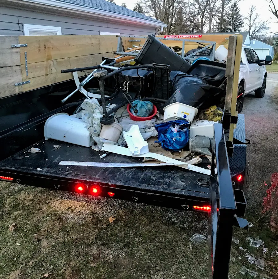 Roll-off dumpster delivered to a residential driveway in Sweden
